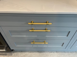 Brass handle on inframe kitchen